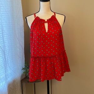 Red top with flower detail ruffled collar and waist detail